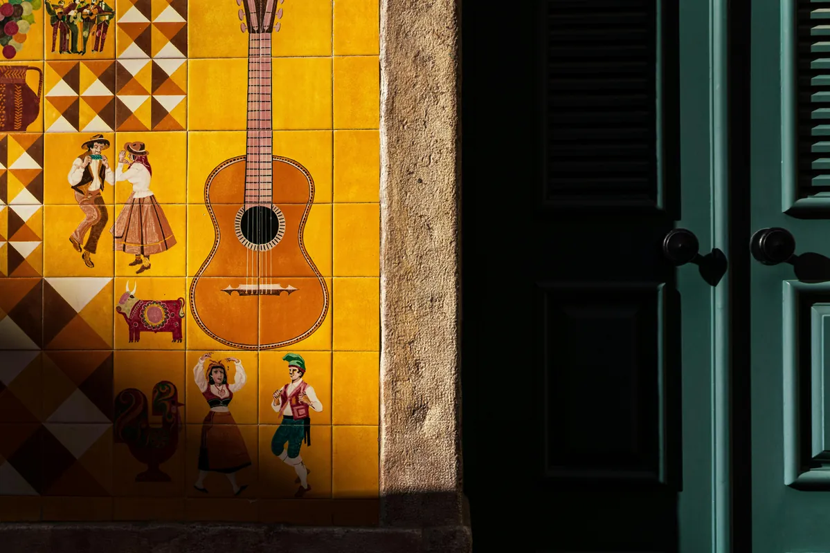 Azulejo tile mural of a Portuguese guitar